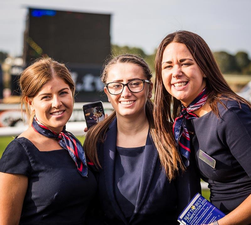 Three staff members posing for a photo at Sedgefield Racecourse.