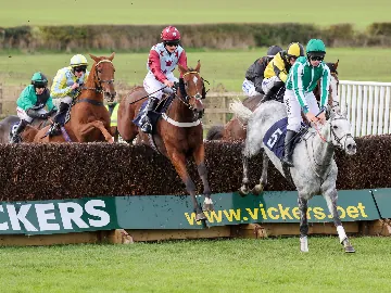 October Wednesday afternoon jumps racing, horses jumping over fence
