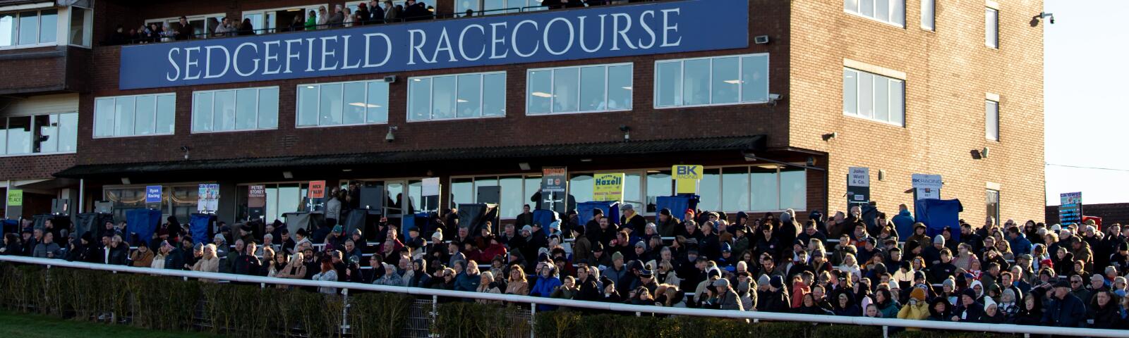 The main stand at Sedgefield with the crowd in front of it